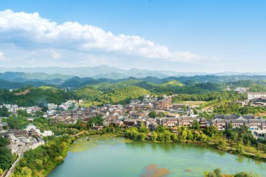 Landscape of Wuyuan County with Yellow oilseed rape field and Blooming canola flowers in spring. It nears Yellow Mountain. It's very quiet. People refer it to as the most beautiful village of China. clipart