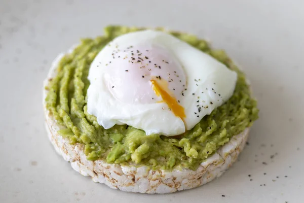 Toast with poached egg and avocado. Healthy breakfast