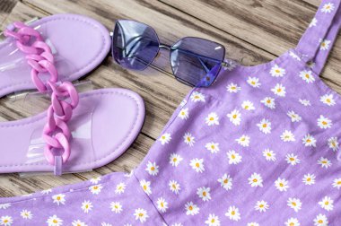 Womens summer clothes in purple shades. Shopping Concept. The Flat Planner.