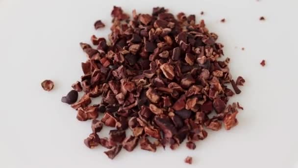 Crushed Cacao Beans Pile White Background Cacao Nibs Selective Focus — Stockvideo