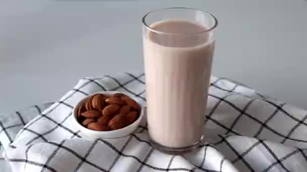 Almond Milk Glass Nuts White Background Checkered Napkin — ストック動画
