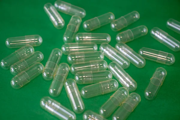 Empty Capsule Pill Bright Green Background Freeze Dried Powder Filling — Zdjęcie stockowe