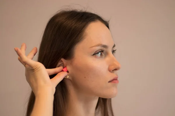 Young Brunette Using Earplugs Protect Herself Noise — 图库照片