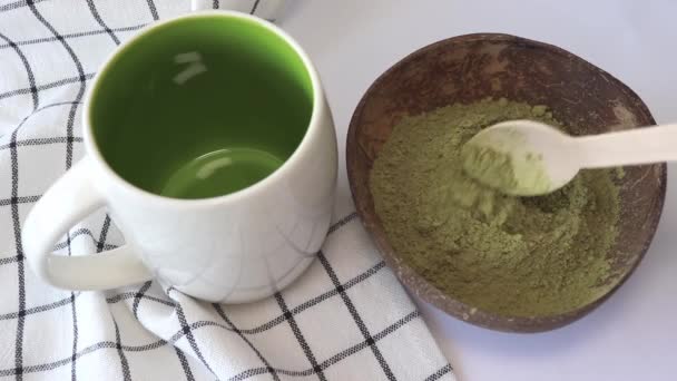 Woman Pours Matcha Green Tea Powder Cup — Stockvideo