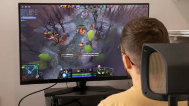 IRPEN, UKRAINE, JUNE 12 20222, Man behind a computer plays Dota 2 computer game Illustrative Editotial