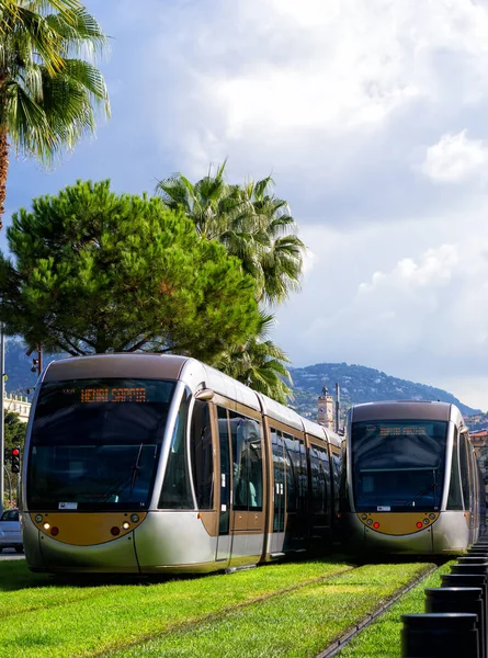 NICE FRANCE - AUGUST 20: Modern tram in the center of Nice France on August 20 2021. For a long stretch of the tram tracks emerge from grass.