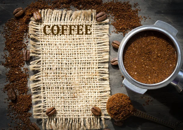 Coffee cone with ground coffee lie on coffee beans on burlap. Photo for advertising a coffee shop. Menu of coffee drinks.