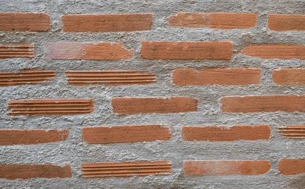 Textured of brick block concrete wall pattern in traditional handmade style with plaster and cement for backgrounds.