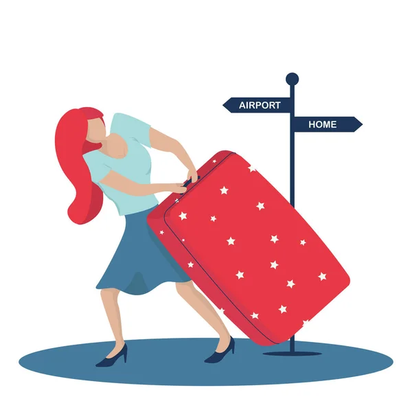 Young woman carrying heavy suitcase