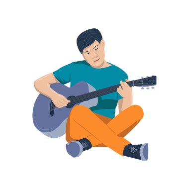 Young man playing the guitar sitting on floor