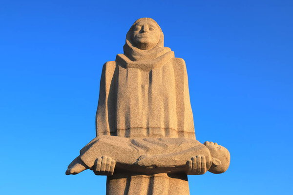 Holodomor in Ukraine. Memorial to victims of Golodomor genocide, a woman is holding child who died of artificial starvation. Monument to the repressed in Ukrainian city Dnipro. Ukraine, 2021-11-24