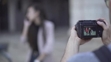 Female Model Talking In The Phone Posing At Photographers Camera - Stolen Shot Concept. - rack focus - Horizontal