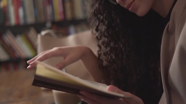 Moroccan Girl Smiling While Reading Book Close Horizontal — Stockvideo