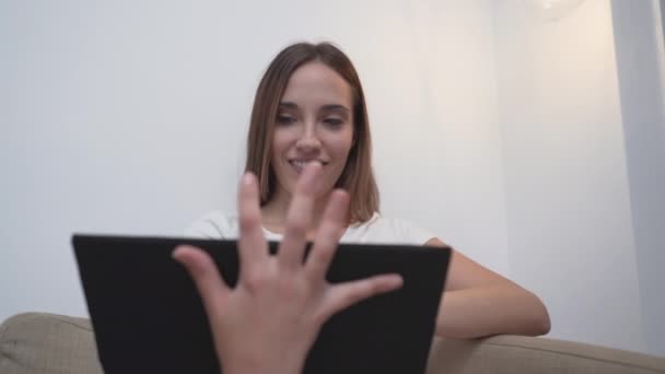 Woman Focused Looking Her Tablet While Sitting Her Living Room — Vídeo de Stock