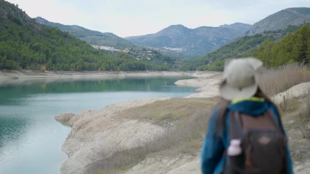 Young Woman Trekking Gear Walks Away Camera Lake Spain Horizontal — Video Stock
