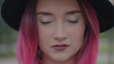 pretty caucasian girl opens the eyes and smiles gently, slowmotion close up - Horizontal 4K video