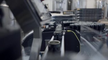Empty Aluminum Beer Cans Moving Along The Conveyor Belt - close up - 4K Horizontal video