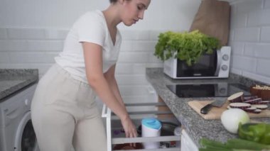 Sliced Nubia Eggplant Transferred In Wooden Bowl. Closeup - Horizontal