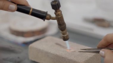 Jeweler With Blowtorch And Tweezer Working In Shop. Selective Focus Shot 4K Horizontal video