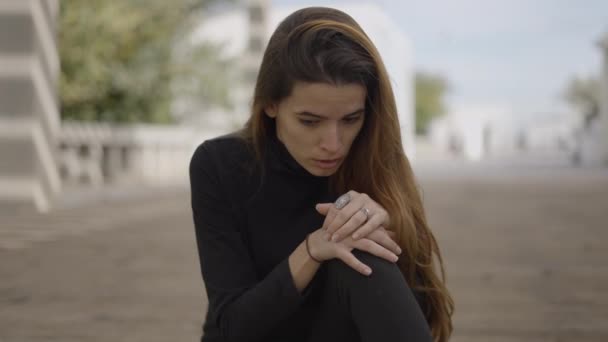 Young Shocked Woman Dressed Black Sits Street Looks Horizontal Video — Stock videók