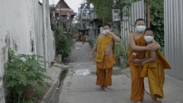 Thai Young Monks Facemasks Playing Together Rural Street Thailand Horizontal — стоковое видео