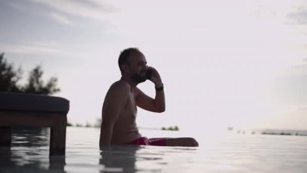Bearded Spanish Adult Man Talking Phone Enjoying Sunset View Infinity — 图库视频影像