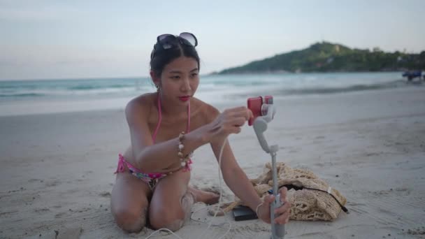 Asian Live Stream Influencer Bikini Connecting Battery Charge Cable Phone — ストック動画