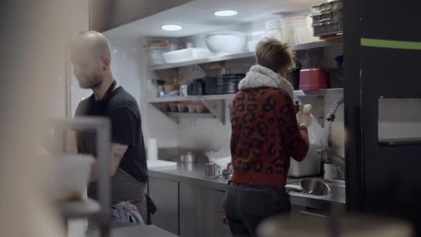 Man Woman Work Restaurant Kitchen Blurry Objects Foreground Horizontal Video — Video Stock