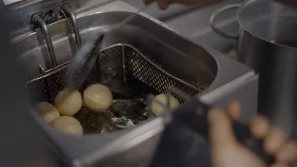 Close View Chef Using Skimmer Deep Fryer Balls Dough Horizontal — Stockvideo