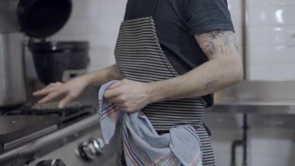 Tattooed Male Chef Wearing Apron Works Restaurant Kitchen Face Horizontal — Video Stock