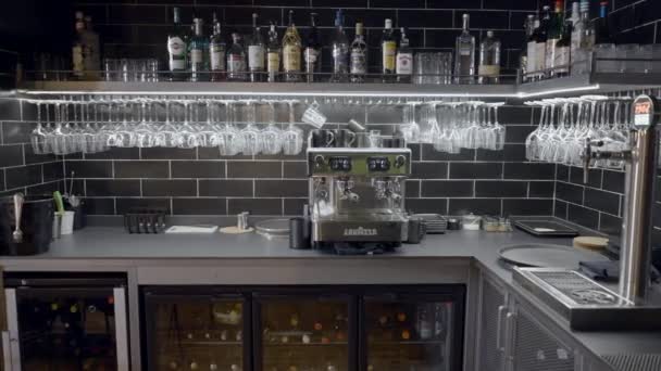 Slow Pan Liquor Bottles Glasses Espresso Machine Bar Horizontal Video — Stock Video