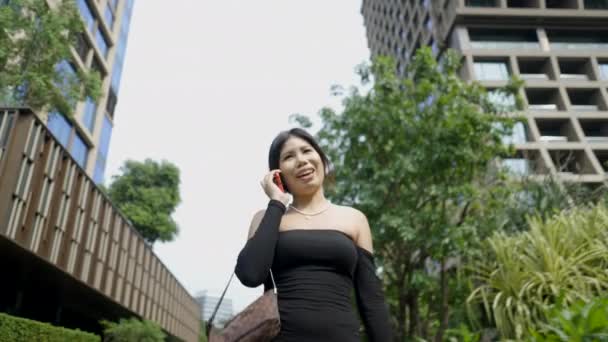 Woman Wearing Black Dress Talking Mobile Phone Hanging Bag Hand — Wideo stockowe