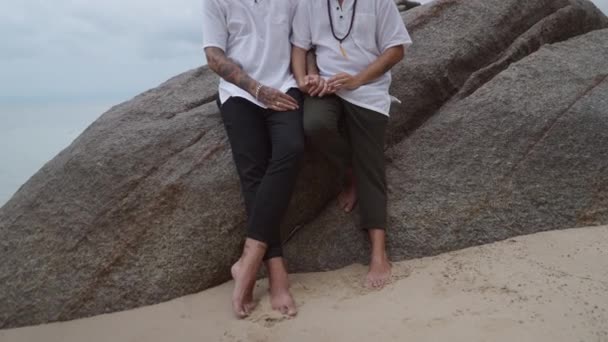 Gay Couple Holding Hands Sitting Close Each Other Big Rock — Vídeos de Stock