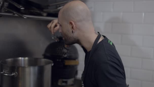 Close Slomo Shot Bald Male Chef Tasting Food Restaurant Kitchen — Stock video