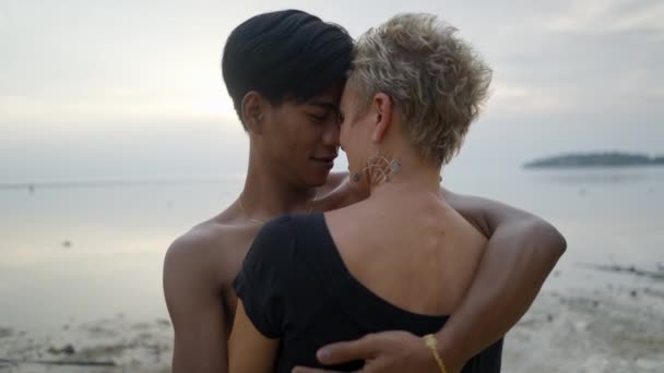 Young Asian Man Embracing Caucasian Mature Woman Kissing Her Sunset — Stok video