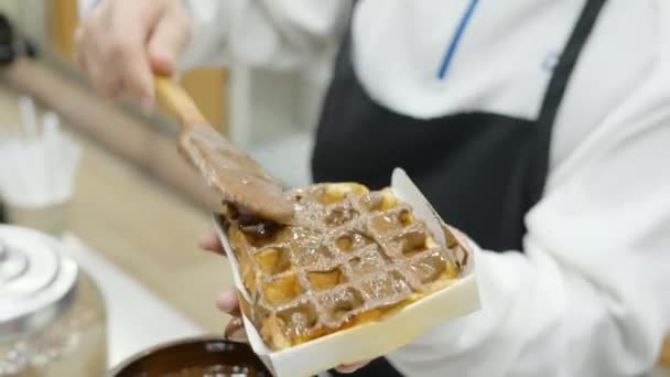 Hand Woman Pouring Smudging Chocolate Waffles Wooden Spoon Night Horizontal — Stockvideo