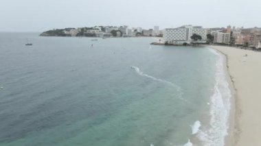 Aerial View Of Person Kitesurfing On The Beach On The Island Of Mallorca - drone shot - Horizontal