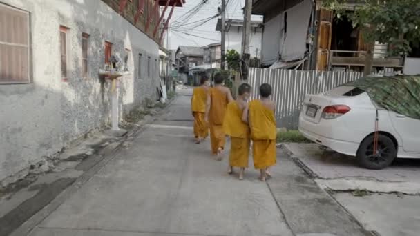 Group Young Monks Walking Street Rural Area Back View Slow — Stockvideo