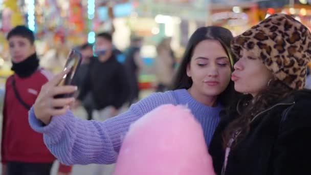Two Female Best Friends Take Pictures Together Funfair Night Holding — Video