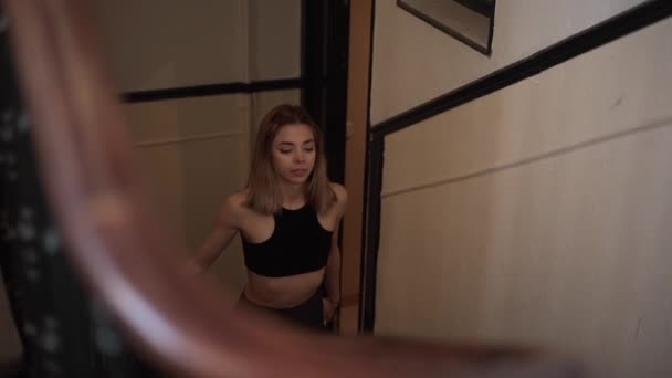 Blonde Girl Sportswear Walking Upstairs Smiling Horizontal Video — стоковое видео