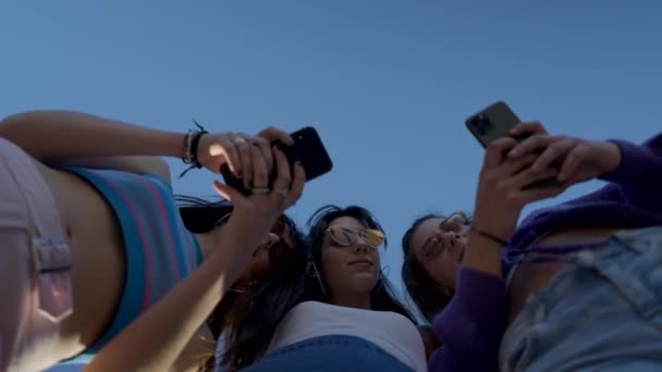 Young Spanish Women Use Phones Talk Smile Close View Horizontal — Stok Video