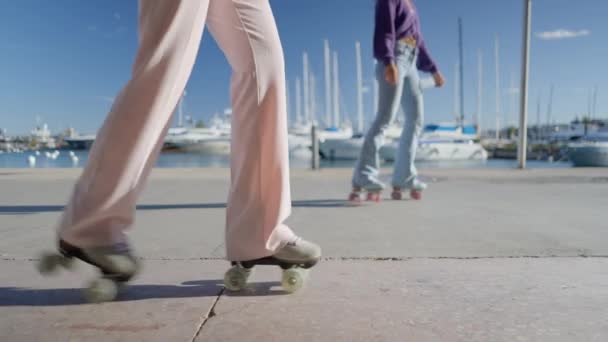 Girl Pink Pants Takes Steps Retro Roller Skates Boats Slomo — ストック動画