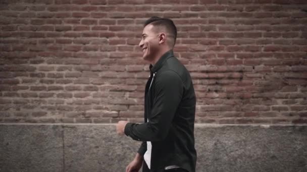 Handsome Hispanic Guy Shows Joy Playful Smile Slow Motion Horizontal — стоковое видео