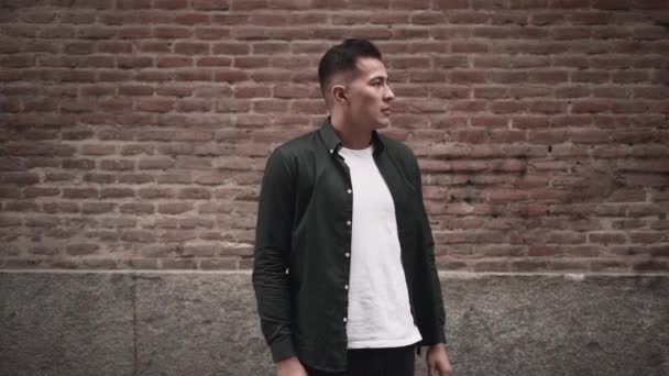 Hispanic Young Man Gives Flirty Confident Look Camera While Crossing — Vídeos de Stock