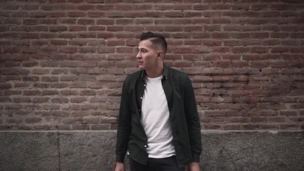 Approach Handsome Latino Man Standing Brick Wall Madrid Horizontal Video — Stok video