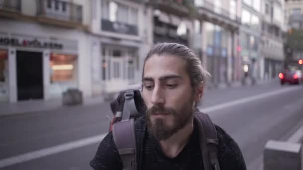Young Backpacker Gives Serious Look Camera Laughs Speaks Camera Man — Video