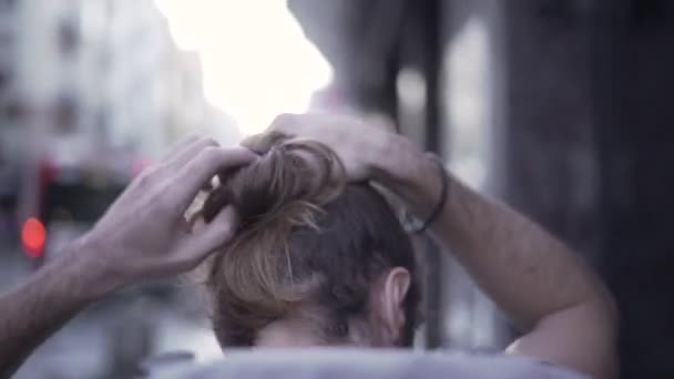 Follow Shot Young Backpacker Walks Ties Long Hair Bun Horizonal — Video Stock