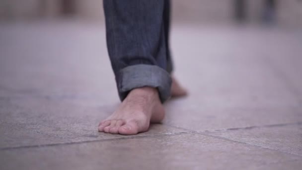 Follow Shot Barefoot Man Walking City Wearing Jeans Horizonal Video — Video