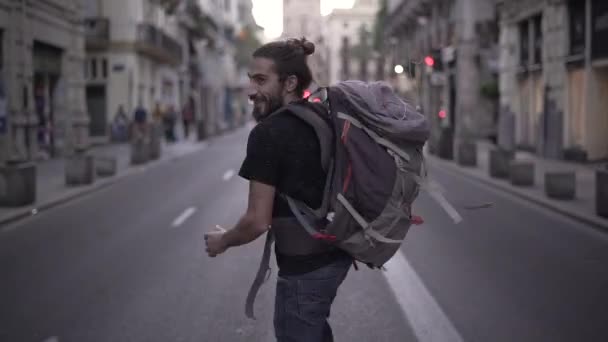 Handsome Backpacker Running Middle Street Smiling Having Fun Gives Look — Vídeo de Stock