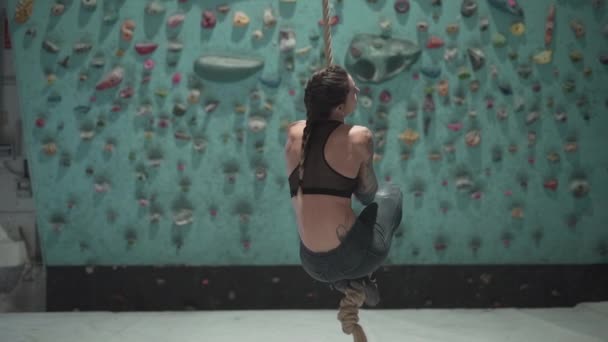 Young Athlete Hanging Climbing Rope Looking Camera Slow Motion Horizontal — стоковое видео